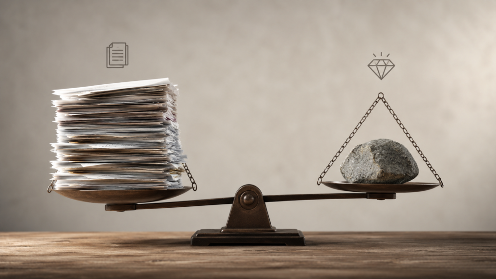 Realistic 16:9 comparison image showing a balance scale with a large stack of documents representing content volume on one side and a single premium-quality asset symbolized by a rock and diamond icon on the other. The scene illustrates the GEO vs SEO approach to content strategy, emphasizing content quality versus content quantity in a professional business environment with natural lighting, neutral tones, and a clean, modern aesthetic.